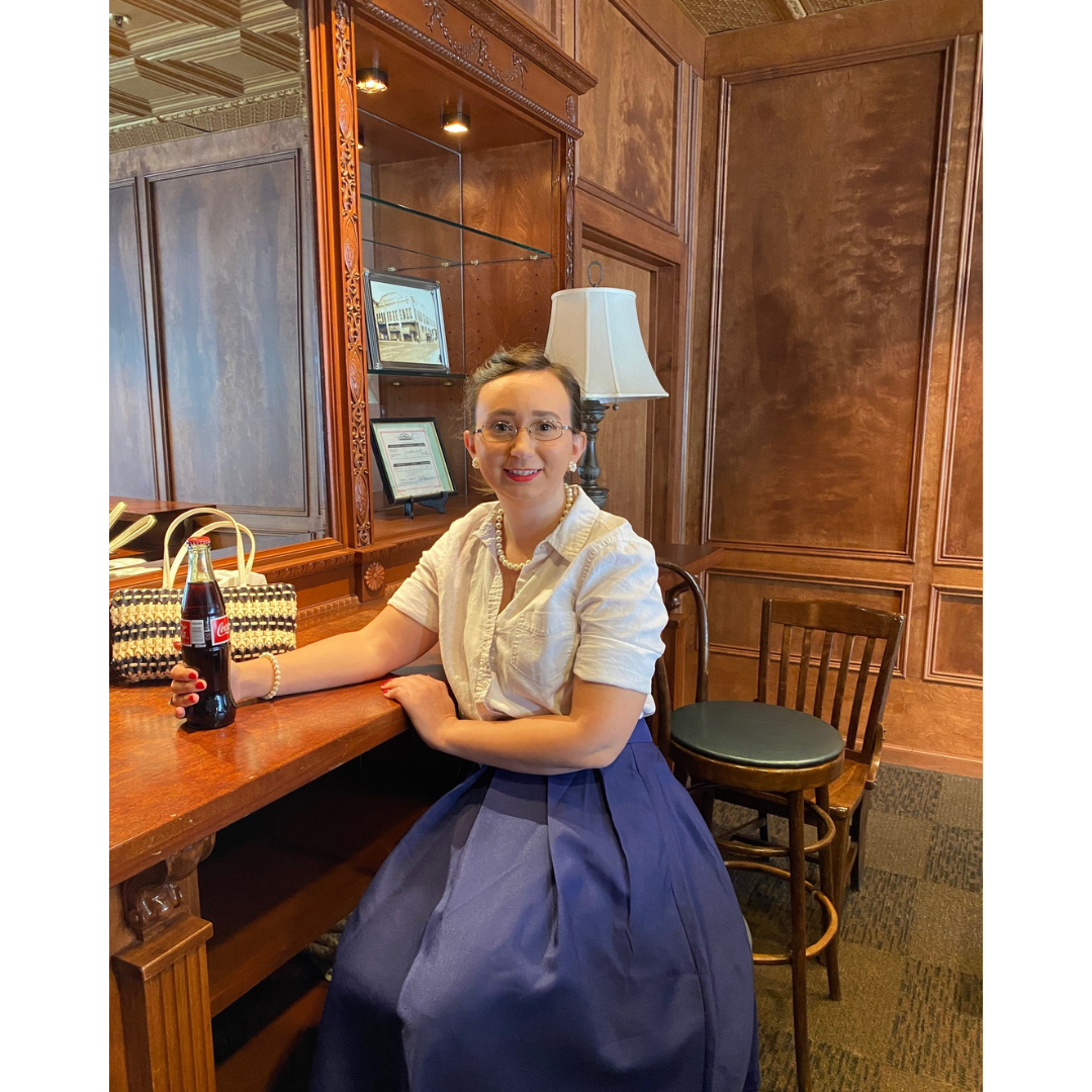Photo of BHM staff member dressed in 1950s period fashion at the Grand Theatre
